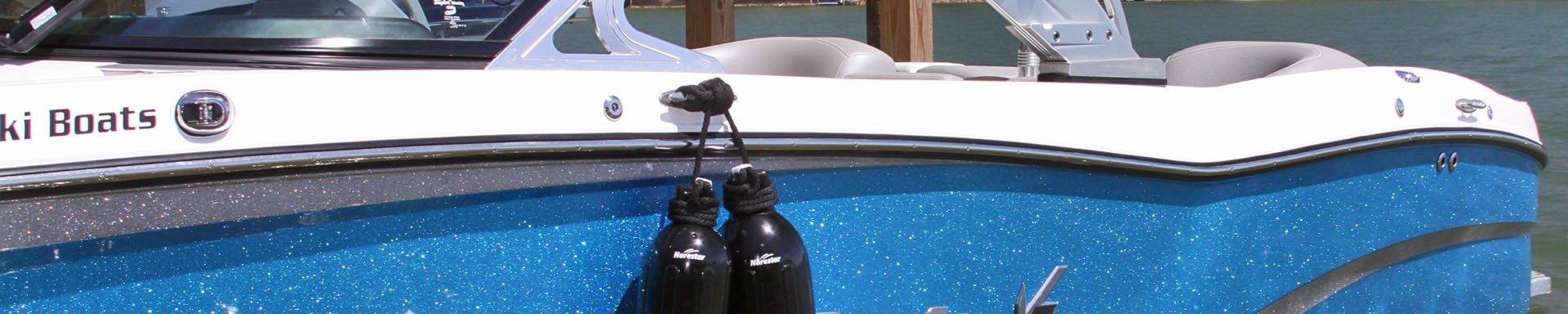 Fenders Hanging on Side of Boat